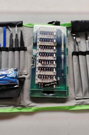 Kit profesional King's Dun KS-8075 abierto sobre estuche de lona gris y verde, mostrando puntas magnéticas, pulsera antiestática azul y herramientas de palanca.